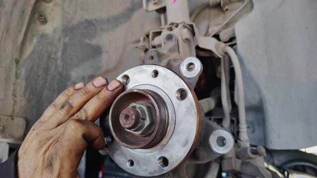 Manually Checking Where Car Brake Disc Is Fitted In The Repair Shop Footage.