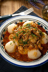 Dumplings with turkey and chorizo sauce.