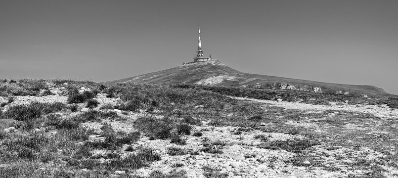 Old radio and television relay device on top of Mount Costila peak in Bucegi Mountains, Southern Carpathians Mountains, Prahova county, Romania in black and white