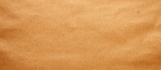 Fototapeta na wymiar Rough Kraft Paper Background, Paper Texture in Orange Beige Colors. Mockup Includes Copy Space