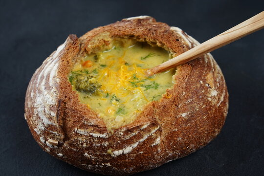 Homemade Broccoli and Cheddar Soup in a Bread Bowl. Czech cuisine