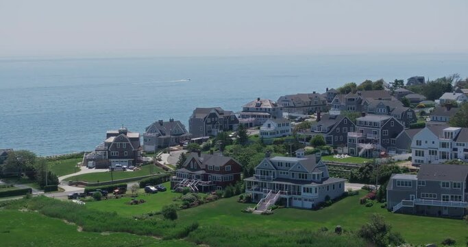 Drone flying by mansions in scituate at the ocean at us east coast