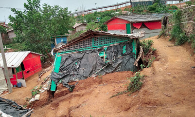 Rohingya refugee tent and house is falling down on the ground.