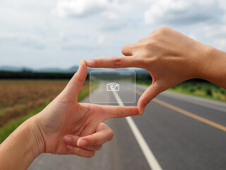 Framed hands Taking pictures Keeping memories on blurred street background. Photographer or...