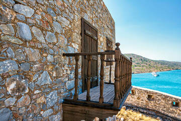 Old house with a balcony on the island of Spinalonga, Crete