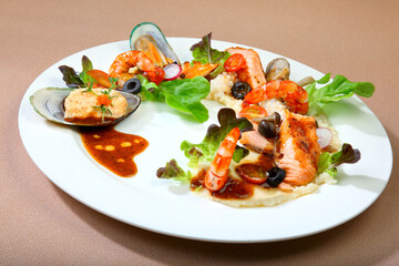 delicious grilled fresh seafood platter muscle, fish, prawn w mash potato and mushroom vegetable in white plate on brown background premium western cafe halal food menu for restaurant