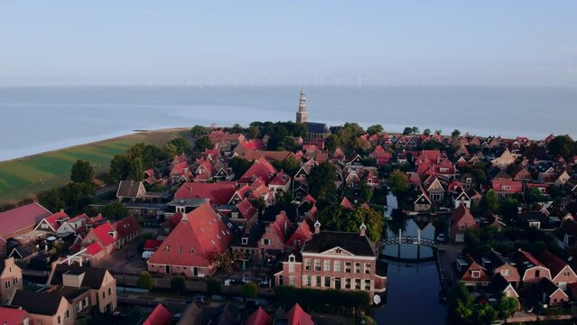 Flying sideways over HIndeloopen, a small City or Village in the Netherlands