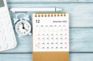 The December 2023 Monthly desk calendar for the organizer to plan 2023 year with alarm clock and...