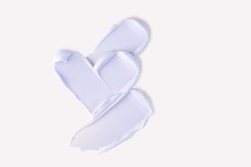 cream or mask stroke isolated on white background. Purple exfoliation cream smear smudge sample. Peeling scrubbing face or body skincare product swatch. showcase of the product