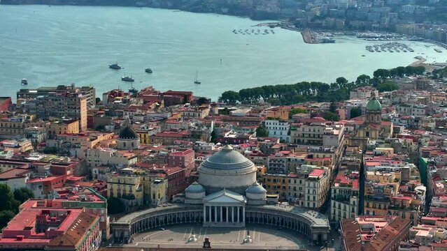 A view of Napoli, Italy, Aerial view of the historic center, panoramic drone view of the entire city of Italy. Flight over historical landmarks, narrow streets and buildings with colour rooftops