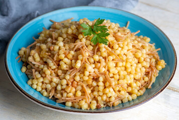 Traditional delicious Turkish food; Couscous pilaf with vermicelli (Turkish name; Sehriyeli kuskus pilavi)