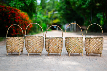 Native of bamboo basket with countryside background.Thai Handicraft Products : Rattan and Bamboo...