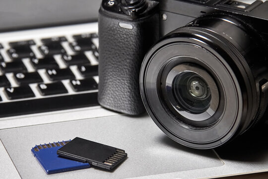 Modern digital camera, memory cards and laptop