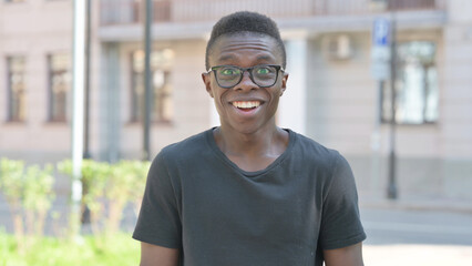 Outdoor Portrait of Surprised Young African Man, Wondering