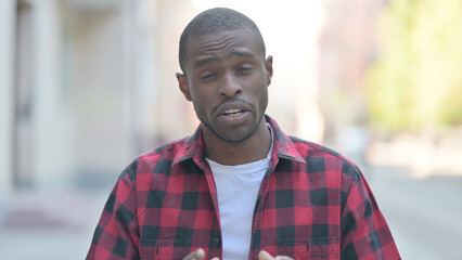 Outdoor Portrait of Young African Man Doing Online Video Chat