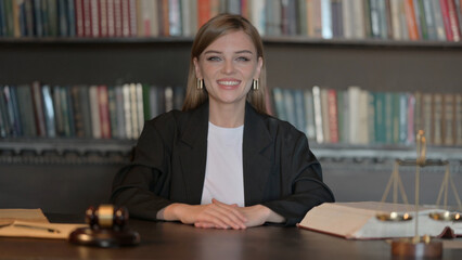 Smiling Young Female Lawyer Looking at Camera