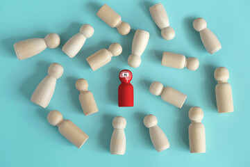  AI. A wooden red figurine with an artificial intelligence brain is different from the crowd. AI can help increase work efficiency or AI to compete for jobs more people to lose their jobs. innovation.