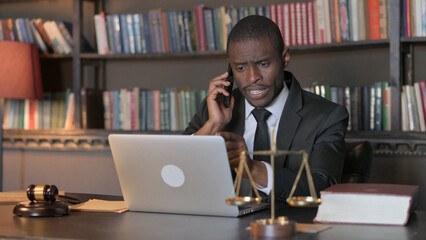 Fototapeta na wymiar African American Lawyer Talking on Phone with Client
