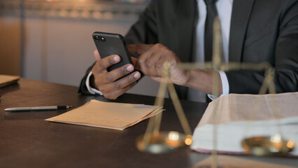African Judge using Smartphone in Cour, Close Up