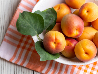 Fresh apricot fruit on the wooden background