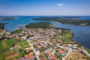 Aerial view of the stunning Croatian coastal town of Pomer with its picturesque oceanfront buildings