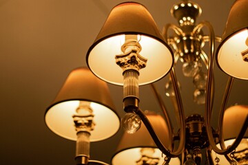Luxury light with a candlestick chandelier style hanging from its frame