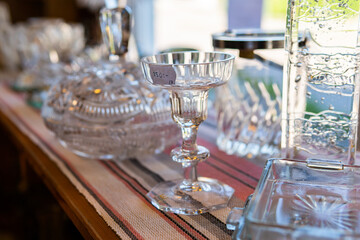 Sweden, Malmo – July 8, 2023: European vintage second hand with many beautiful unusual things, porcelain, bijouterie, jewelery. Flea market, garage sale.