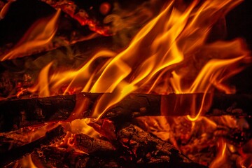 Glowing burning bonfire outdoors at night - great for wallpapers