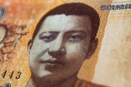 Closeup of the Norodom Sihanouk, king of Cambodia, as depicted on 100 Riels banknote - Powered by Adobe