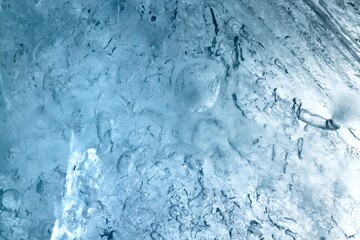 Shot of a glistening ice crystal in the wintertime from a frozen lake