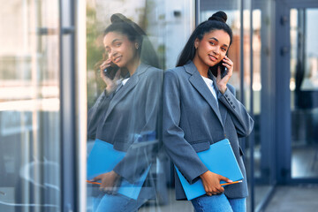 Business woman at the entrance to an office building