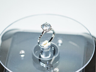 White zircon silver ring display on white background