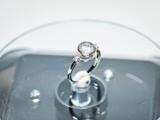 White zircon silver ring display on white background
