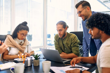 A group of young freelancers working in a coworking space