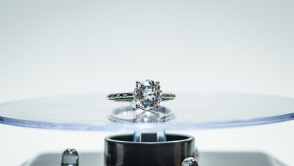 White zircon silver ring display on white background