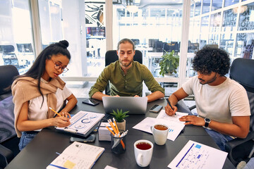 A group of young freelancers working in a coworking space