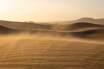 Vast expanse of golden sand with a deep blue sky in the background