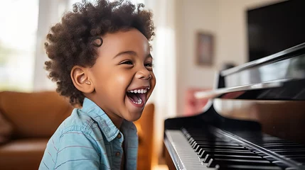 Fotobehang Boy learn to play piano, music playing © thesweetsheep