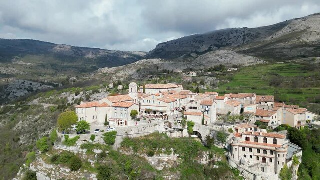 Drone view over the residential buildings on a hill in Gourdon