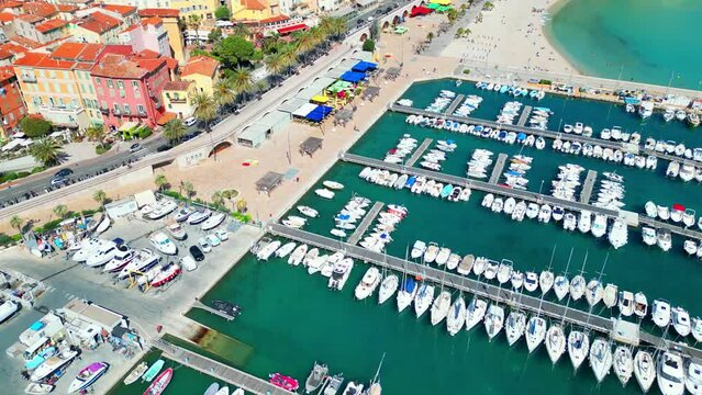 Aerial video of crystal clear sea and colorful buildings, Menton, France