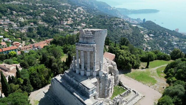 Drone footage over Tropaeum Alpium with seascape on a sunny day