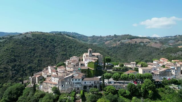 Aerial of the beautiful old Bussi sul Tirino commune in Italy surrounded by green trees
