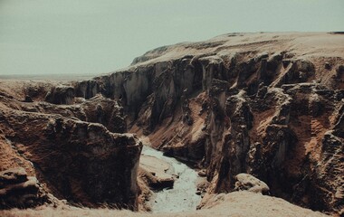 Majestic cliff with a rushing waterfall cascading over its edge