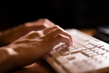 Male hand typing on the keyboard