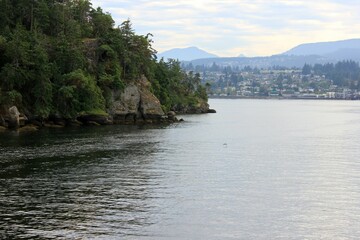 Fototapeta na wymiar Nanaimo city seen from the ferry on summer day. British Columbia, Canada