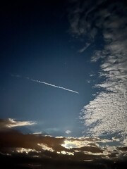 Moonlit sky with clouds and stars