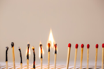 Concept of matches in a row indicating separation from others to control covid