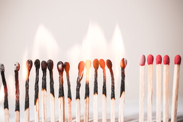 Concept of matches in a row indicating separation from others to control covid