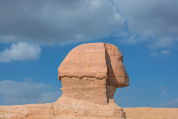 The Sphinx of Giza next to the Pyramids in the desert, Egypt in Asia