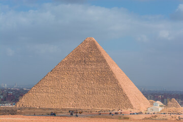 The Sphinx of Giza next to the Pyramids in the desert, Egypt in Asia
